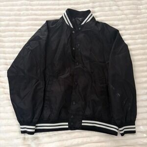 Black varsity jacket with white stripes